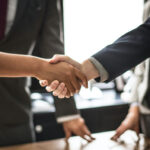 Business people shaking hands in a meeting room