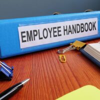 Text sign showing the printed words Employee Handbook